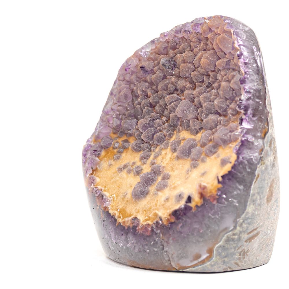 Amethyst geode with a citrine crystal point, mounted on a metal stand.